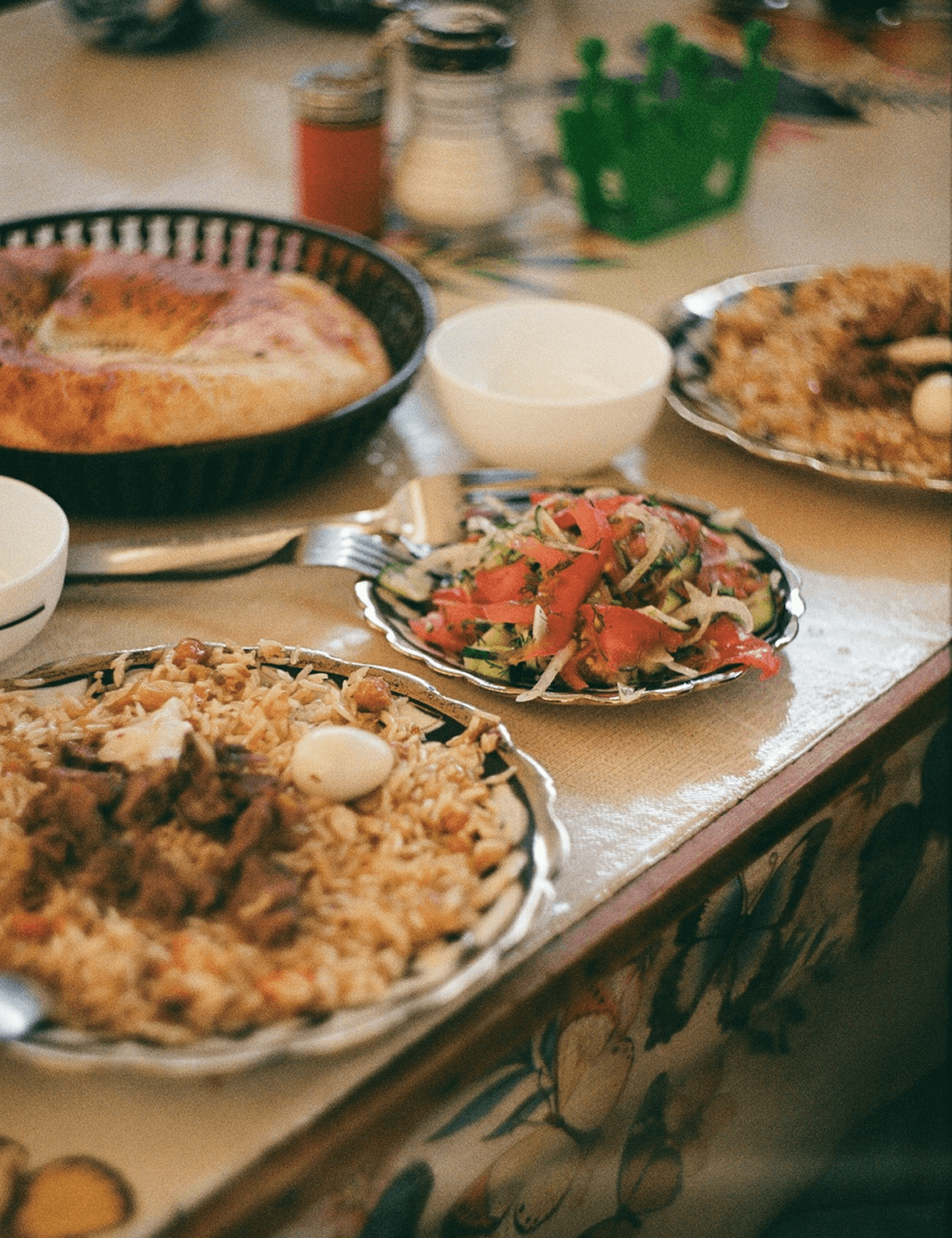 Traditional Pakistani meal with biryani, salad and naan